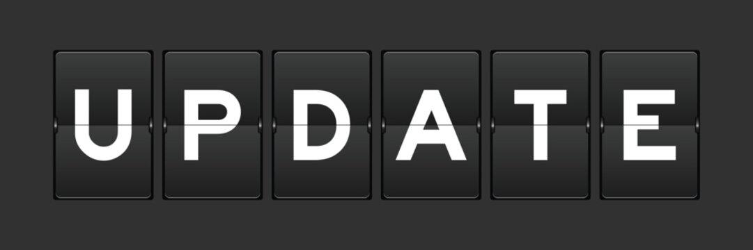 Black color analog flip board with word update on gray background