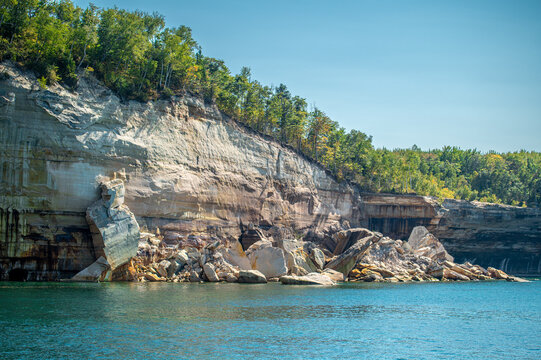 Collapsed sandstone cliff at Pictured Rocks National Lakeshore with large rock debris in Lake Superior following a natural rockfall near Munising, Michigan.