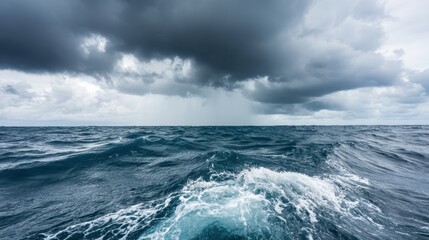 Naklejka premium Turbulent sea with crashing waves and foam under overcast sky. Dynamic ocean texture with splashes and movement. Dramatic marine background with intense atmosphere