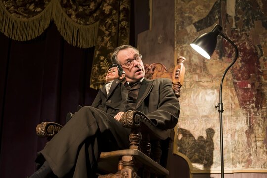 Magician with Puppet on Stage Performance