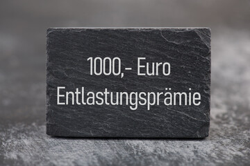 Fototapeta premium Relief bonus in german language, economic, financial and energy crisis, inflation, poverty, increase of living costs, social issue, income payment, extra money 