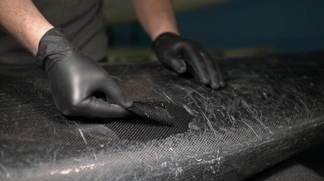 Glue.Boat repair. Canoe slalom. Carbon fiber. Slow motion video. High quality 4k footage