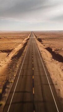 Vertical video: Starting clip, camera moving along highway in desert to horizon, with centerline