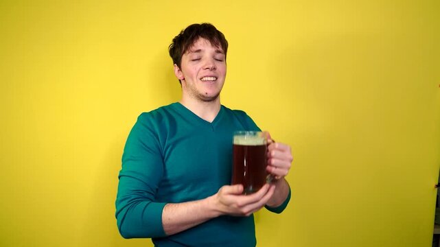 Beer. Oktoberfest. Handsome man drinking beer of glass. Smiling  hipster drinking craft beer.