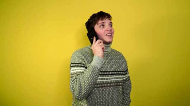 Phone call by cellphone. Attractive charismatic stylish guy has an unpleasant phone