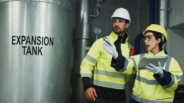 Facility Inspector Compiles Pipe Installation Reviews. A professional inspector compiles comprehensive reports on pipe installation and temperature control systems for management.