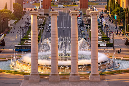 Sunset in Barcelona, Spain. Square of Spain. Evening panorama, view at Columns and a beutiful fountain behind. Street photo. Europe travel destination.