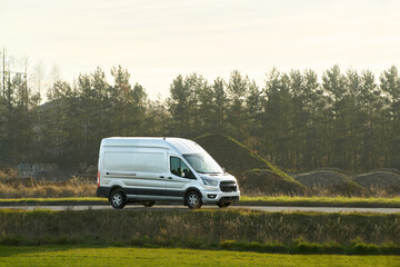 Fototapeta premium White transport vehicle on countryside route