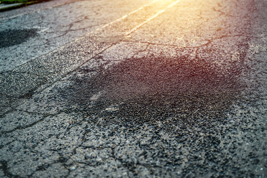 High pressure spray patching on worn street surface