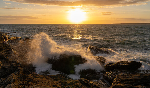 Sunset and waves at Trearddur Bay Anglesey 
