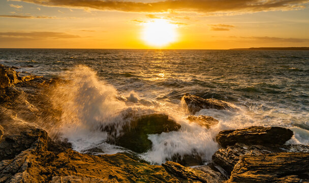 Sunset and waves at Trearddur Bay Anglesey 