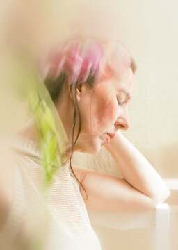 Portrait of a woman in high key with slow exposure effects IV