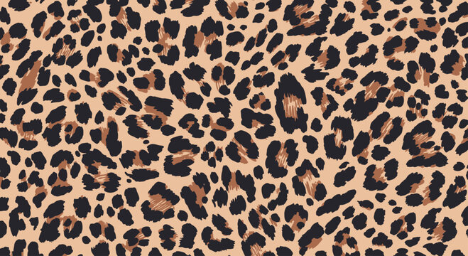 A full-frame close-up shot of a beige and black leopard print pattern