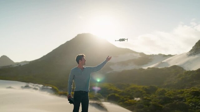 Slow Motion Man Taking Off and Flying Drone on Betty's Bay Sand Dunes, Remote Pilot in Cape Town South Africa