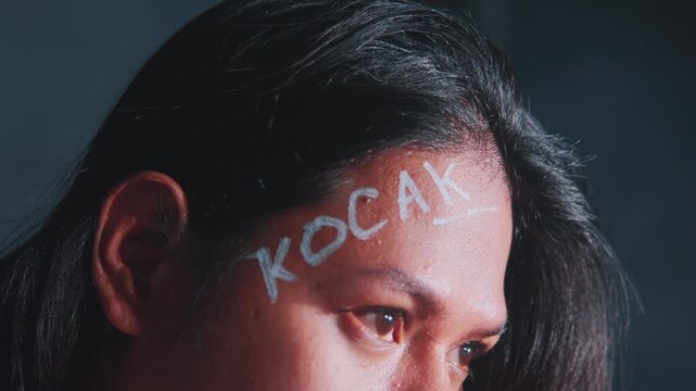 Thoughtful Portrait with Painted Forehead