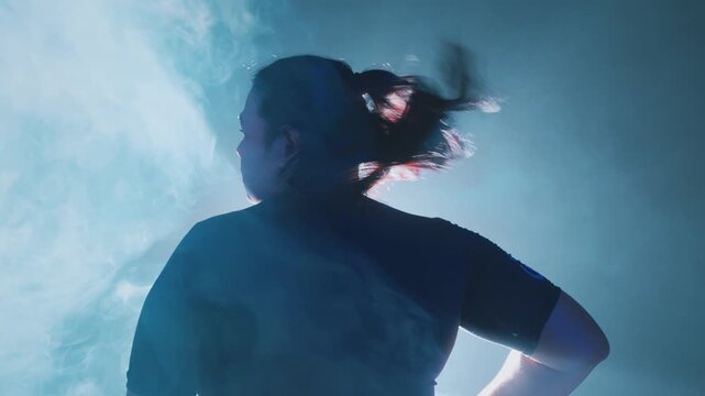 Silhouette in Smoke with Dramatic Lighting