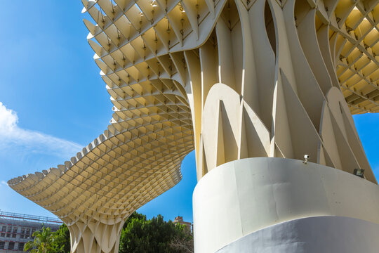Seville, Andalusia, Spain &ndash; Feb 13, 2020: The unique wooden structure of Metropol Parasol, known as Las Setas de la Encarnaci&oacute;n, rises dramatically against a bright blue sky, showcasing its innovative