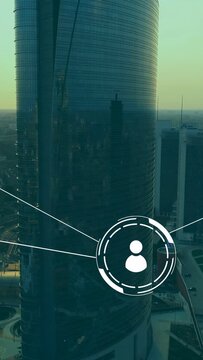 Vertical video: Glass tower center HUD animating in from right drawing lines and showing IT network