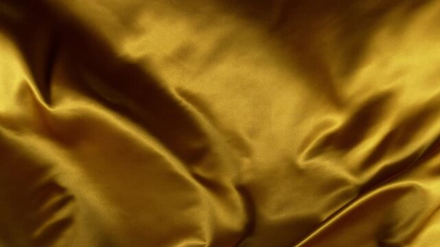 Super Slow Motion of Waving Golden Satin Cloth. Filmed on High Speed Cinema Camera, 1000 fps