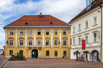 Fototapeta premium View of Market square in Sankt Veit an der Glan Carinthia Austria. Historic buildings and facade architecture under cloudy sky