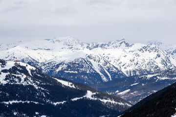 Obraz premium Pas de la Casa ski slopes and snowy Pyrenees mountains