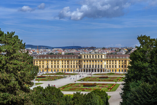 High angle view of Schonbrunn Palace in Vienna Austria. Historic imperial architecture and gardens under cloudy sky