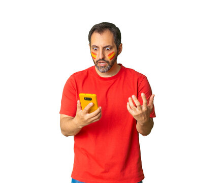 Spanish soccer fan reacting to phone on transparent background