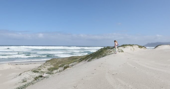 teens and children sand boarding dunes, Walker Bay Nature Reserve, Stanford, South Africa