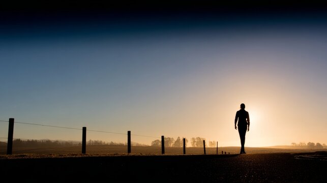figure. Silhouette against sunset horizon, using negative space for dramatic emotional impact. inspiring travel planning.
