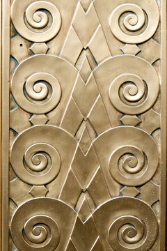 Gold Art Deco spiral relief pattern background