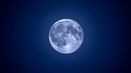 Obraz premium fullmoon. A stunning super moon illuminating the night sky with its detailed surface against a dark blue backdrop. STEM education sheets. 