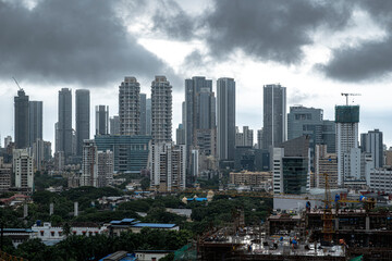 Fototapeta premium Modern City high-rise skyscraper buildings. Aerial drone view of the Financial District in Mumbai. Daytime Mumbai City, India