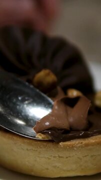 Chocolate syrup pouring on chocolate brownies. Tasty dark rich brownies served with raspberries