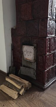 Vintage tiled stove burning firewood