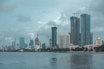 Fototapeta premium Modern City high-rise skyscraper buildings. Aerial drone view of the Financial District in Mumbai. Daytime Mumbai City, India.