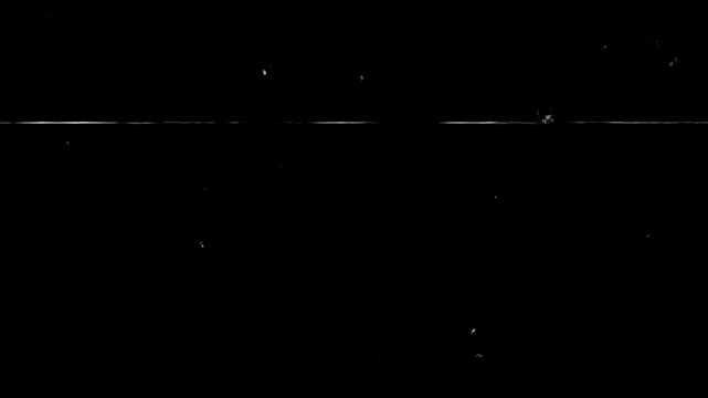 Old film grain texture with dust particles scratches and scan line seamless vintage overlay for retro video effect