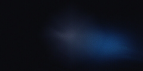 Obraz premium Dark abstract background with a blue and purple light glowing through a cracked texture.