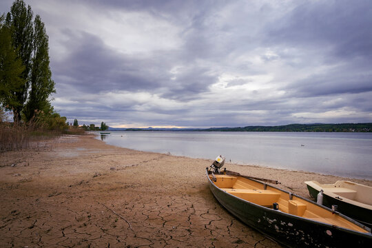 Low water shoreline with boats at Niederzell Reichenau on Lake Constance, Baden-W&uuml;rttemberg, Germany
