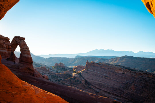 Sun shines on a clear day upon the arches and other rock formations