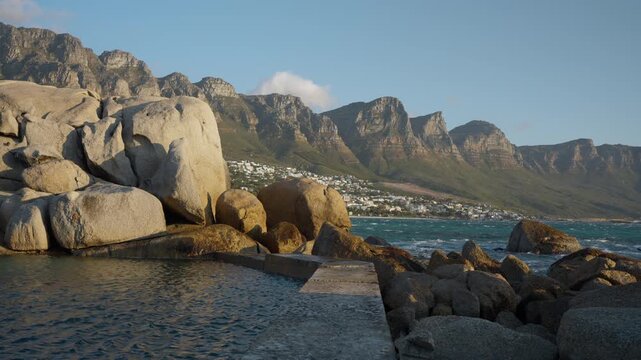 Sunset at Maiden's Cove Tidal Pool with Crashing Waves, Cinematic Mountain Reflection in Cape Town South Africa