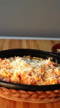Traditional Caribbean Patacon Covered With Shrimp Sauce And Cheese Close Up.