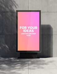 A vertical lightbox with a white background stands on a metal support against a concrete wall for presenting your ideas. Presentation space. Advertising space. 3D rendering © Vladislav
