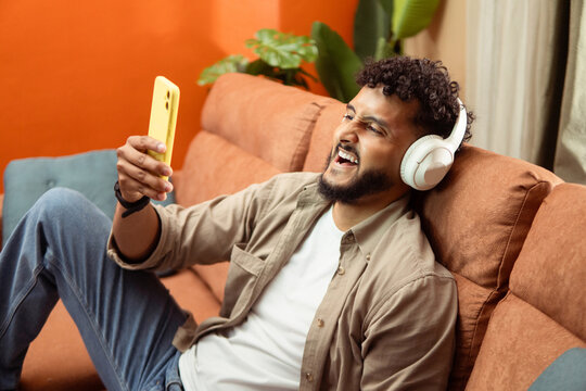 Person listening to music device enjoying streaming content