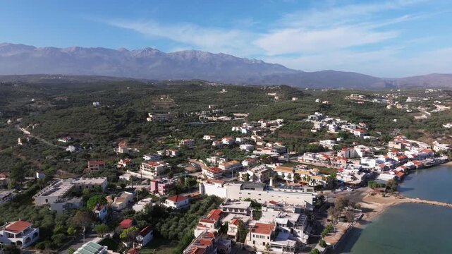 Aerial drone shot.View of famous beach in the summer, Crete, Greece. Famous beach with river and palm trees in Libyan sea. Tropical island, Panoramic view, Most beautiful beaches of Crete island