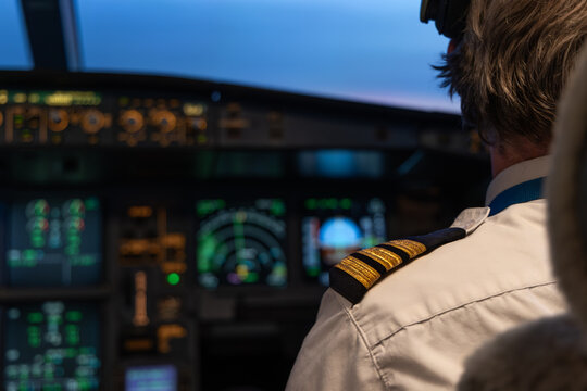 Airplane cockpit with pilot uniform and flight instruments