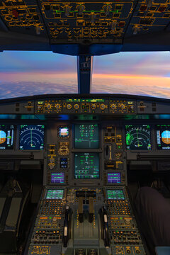 Airplane cockpit view above clouds at sunset with instruments