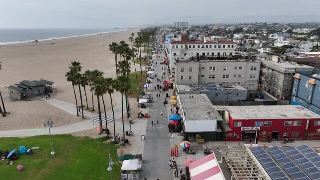 Venice Beach, California, USA - Aerial Top View of Boardwalk on the Marvin Braude Bike Trail With Stores and Palm Trees