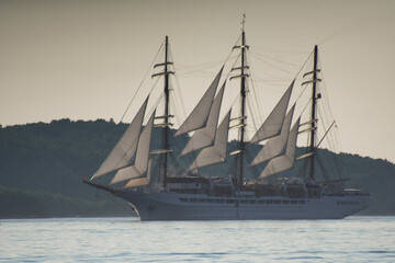 Obraz premium Traditional sailing ship at sea near coastline, Mediterranean travel destination