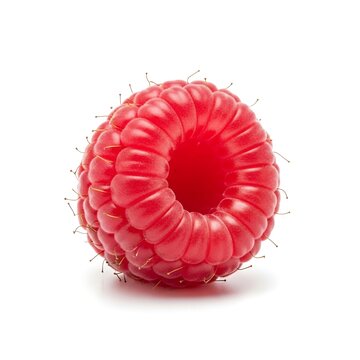 A bright red raspberry with visible drupelets and delicate filaments, isolated on white