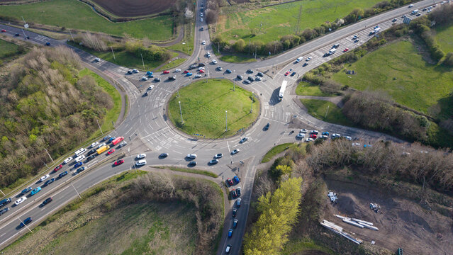 Wide-angle drone shot of the Sheriffhall highway interchange. Detailed perspective of road infrastructure, markings, and the large-scale engineering of the Edinburgh City Bypass